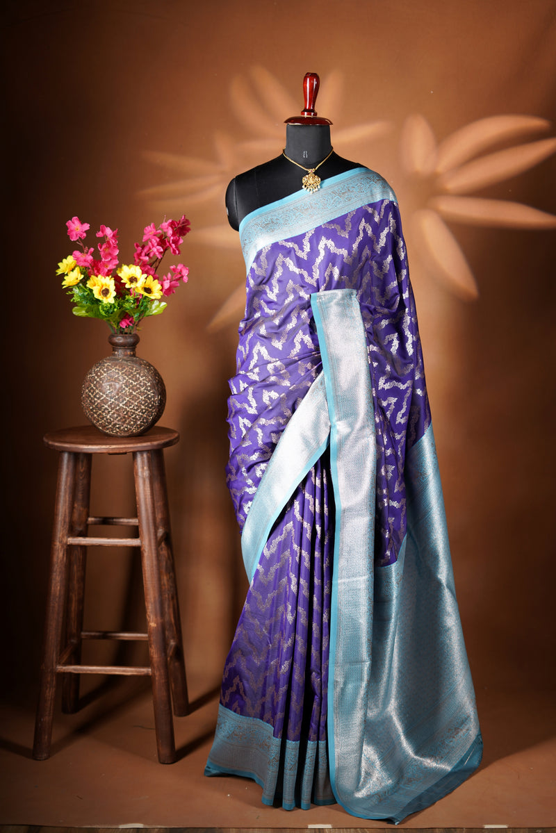 Royal Blue Banarasi Saree - A masterpiece of weaving, our Royal Blue Necklace Saree features a cascading silver-gold pattern that catches the light with every move with add on contrast blouse