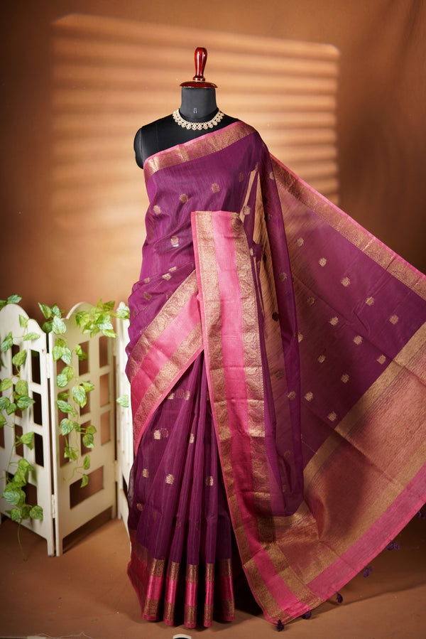 plum Kora Cotton Saree - Styled in a natural  dark tone, this Kora Cotton saree creates a comfort and rich look with copper contrast border, paired with a matching blouse