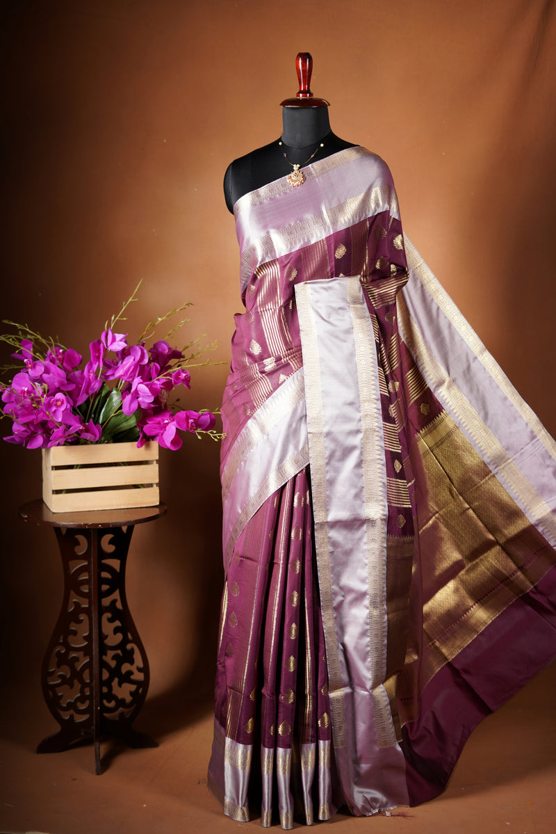 Kancheepuram Silk Saree - Maroon bodice with golden lurex line through the saree designed with rich border pattern work with zari buttas add on matching silk blouse piece.