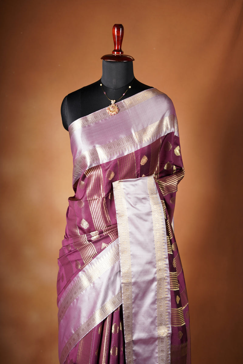 Kancheepuram Silk Saree - Maroon bodice with golden lurex line through the saree designed with rich border pattern work with zari buttas add on matching silk blouse piece.