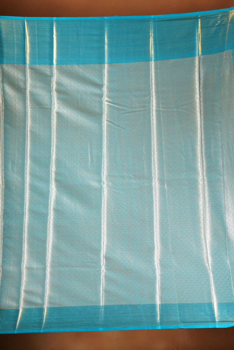 Light blue fabric with white stripes on a wooden surface
