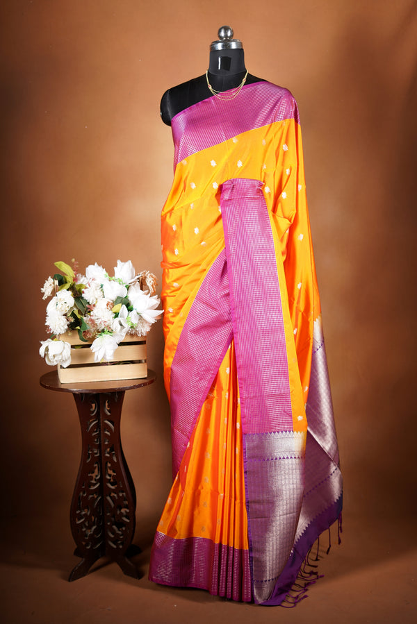 Soft Silk Saree –  bright yellow bodice Elegant shimmer drape featuring lurex check pattern shiny metallic threads woven in a grid design with stylish pink border. Comes with attached blouse. Lightweight, blending modern sparkle.