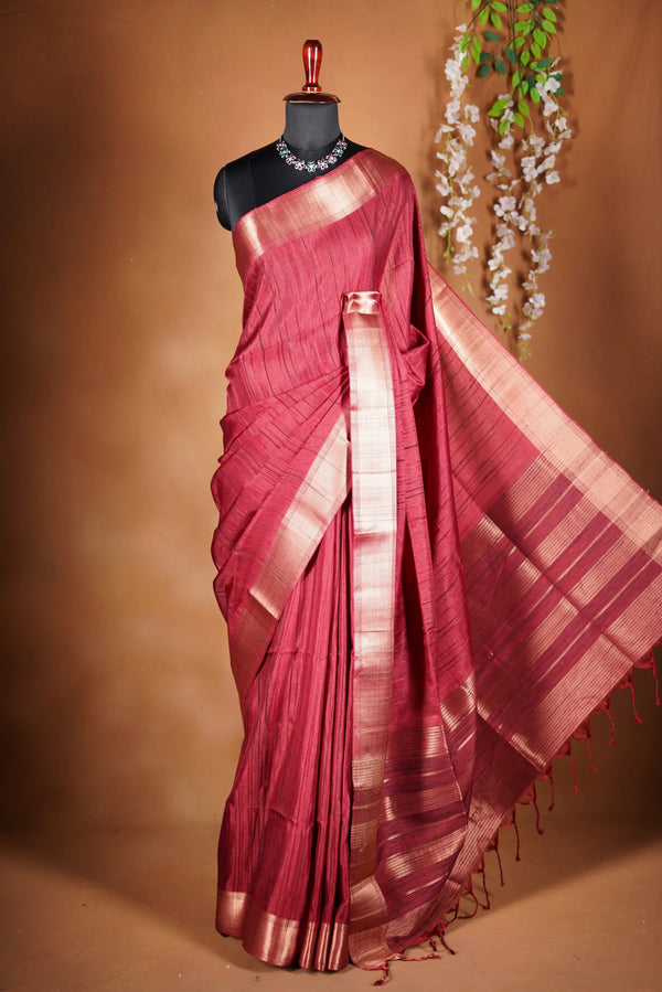 Crimson Red Semi Tussar Saree | Gold Zari Border Plain Body | Traditional Festive WearCrimson red Semi Tussar Saree - The rich hue is elevated with a smooth texture and a shimmering zari border and attached blouse that enhances its festive appeal