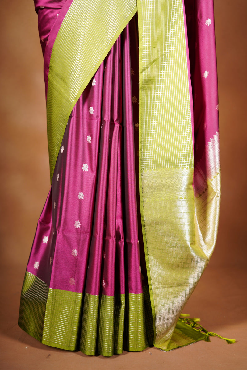 Soft Silk Saree –  rasberry pink bodice with contrast border Elegant shimmer drape featuring lurex check pattern shiny metallic threads woven in a grid design with stylish green border. Comes with attached blouse. Lightweight, blending modern sparkle.