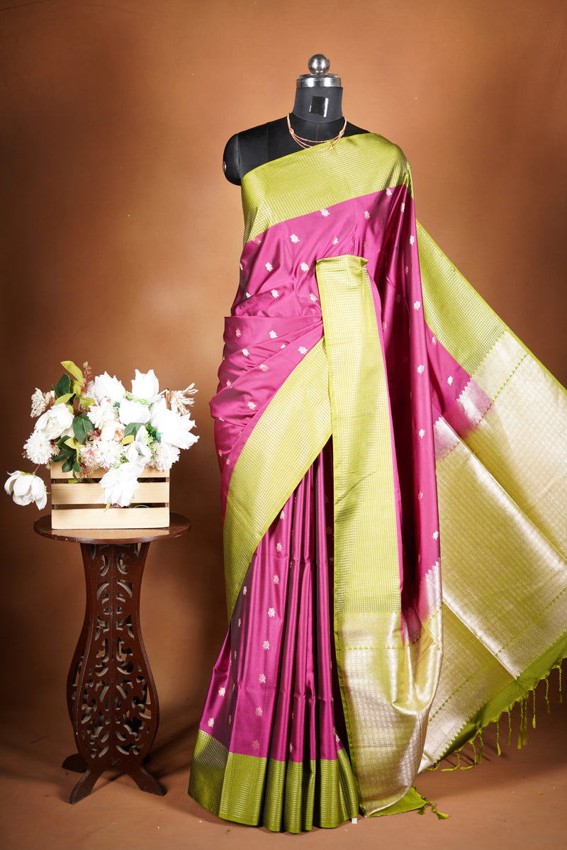 Soft Silk Saree –  rasberry pink bodice with contrast border Elegant shimmer drape featuring lurex check pattern shiny metallic threads woven in a grid design with stylish green border. Comes with attached blouse. Lightweight, blending modern sparkle.