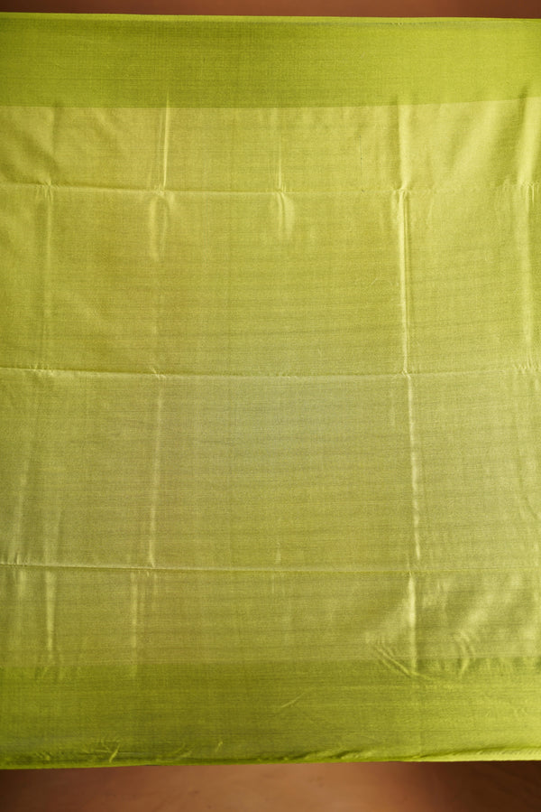 Soft Silk Saree –  rasberry pink bodice with contrast border Elegant shimmer drape featuring lurex check pattern shiny metallic threads woven in a grid design with stylish green border. Comes with attached blouse. Lightweight, blending modern sparkle.