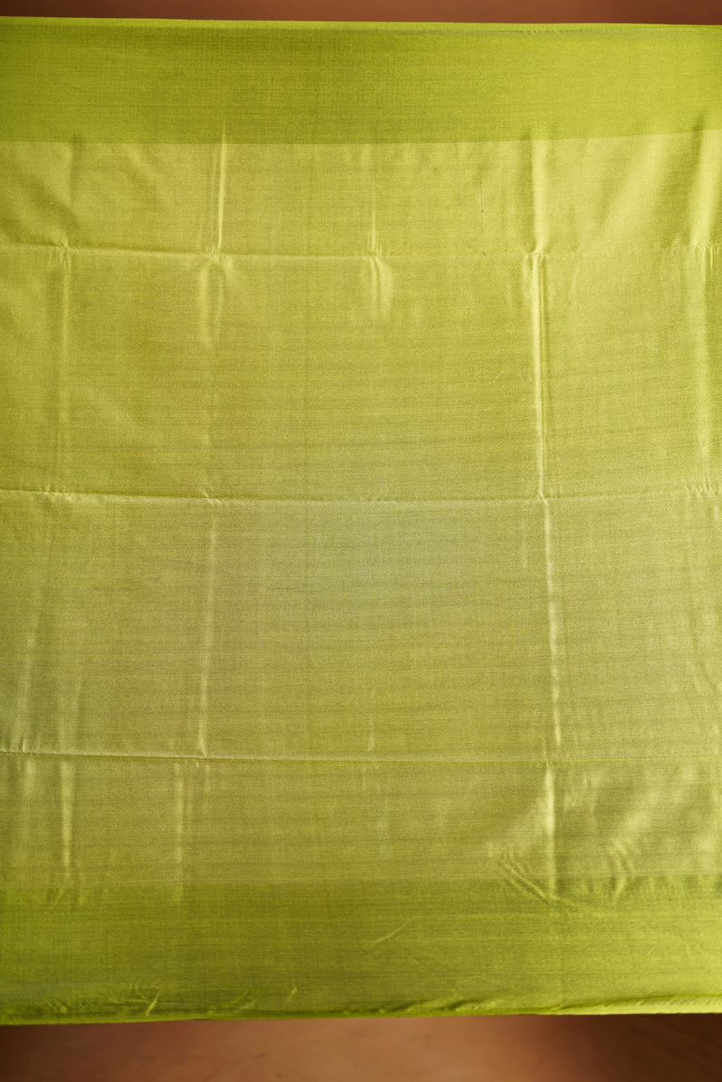 Soft Silk Saree –  rasberry pink bodice with contrast border Elegant shimmer drape featuring lurex check pattern shiny metallic threads woven in a grid design with stylish green border. Comes with attached blouse. Lightweight, blending modern sparkle.