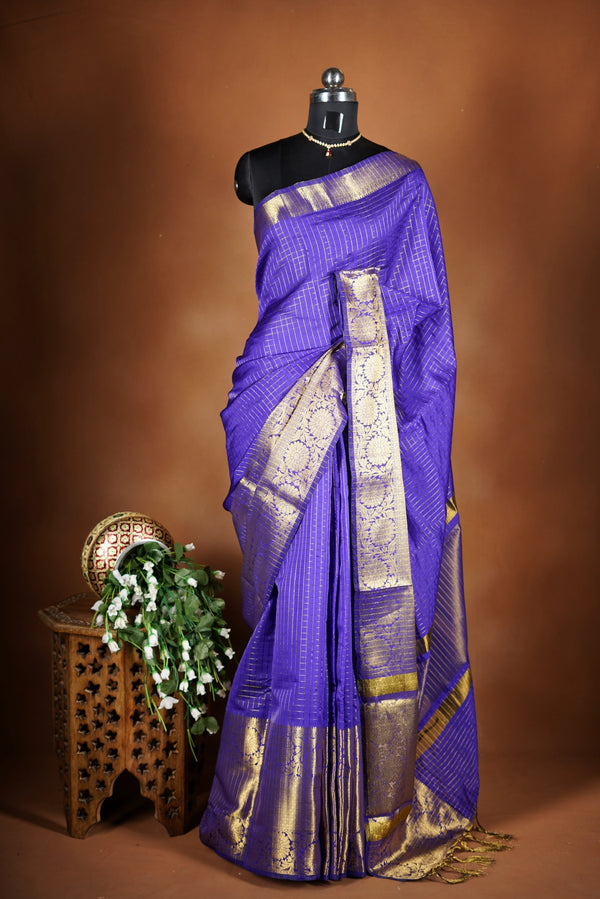 Royal Violet Fancy cotton saree -   elegance with this stunning violet georgette saree, featuring a rich lurex checks in body. The saree is adorned with fine zari detailing and a beautifully crafted border that adds depth and richness.