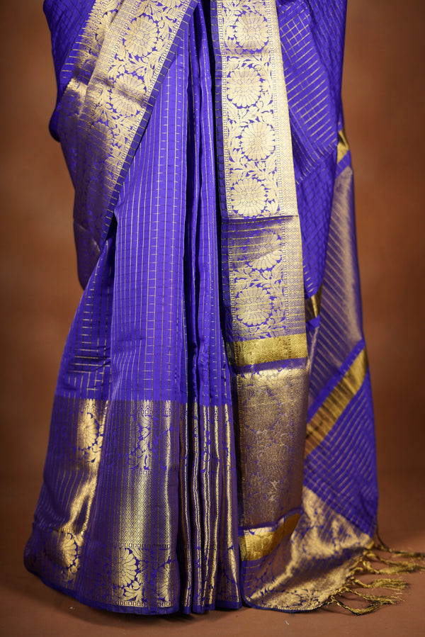 Royal Violet Fancy cotton saree -   elegance with this stunning violet georgette saree, featuring a rich lurex checks in body. The saree is adorned with fine zari detailing and a beautifully crafted border that adds depth and richness.