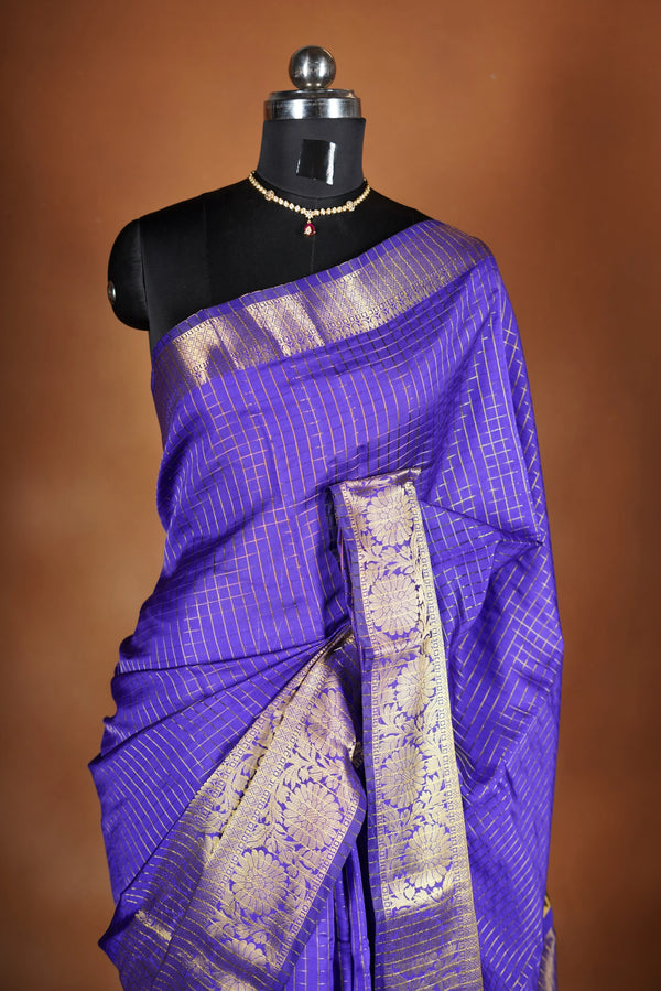Royal Violet Fancy cotton saree -   elegance with this stunning violet georgette saree, featuring a rich lurex checks in body. The saree is adorned with fine zari detailing and a beautifully crafted border that adds depth and richness.