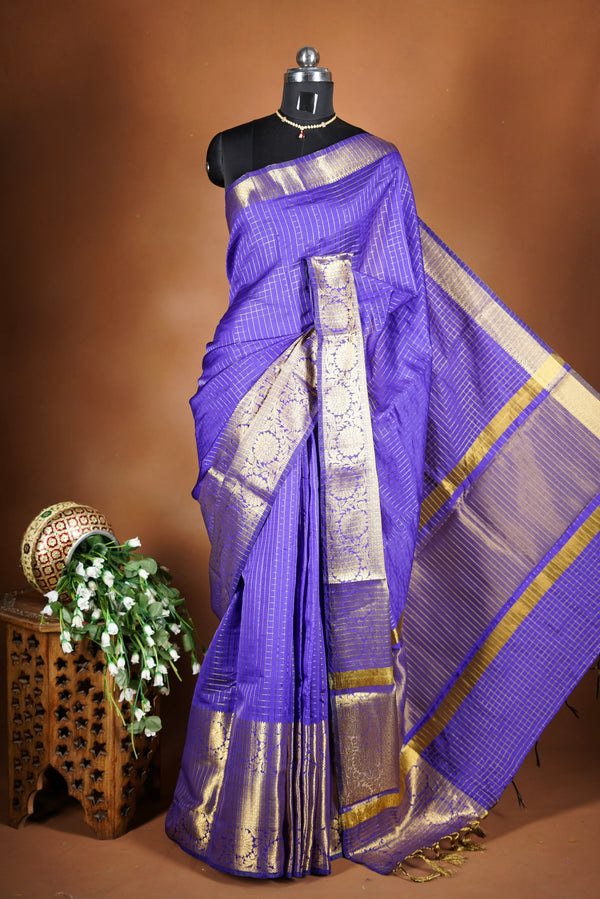 Royal Violet Fancy cotton saree -   elegance with this stunning violet georgette saree, featuring a rich lurex checks in body. The saree is adorned with fine zari detailing and a beautifully crafted border that adds depth and richness.