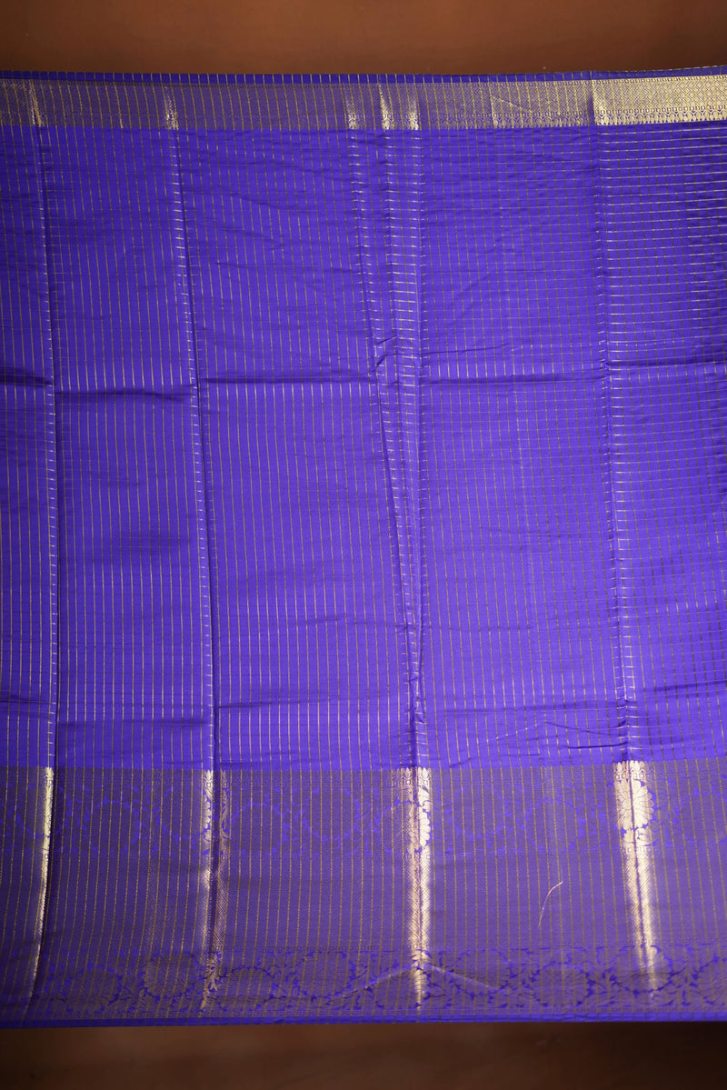 Royal Violet Fancy cotton saree -   elegance with this stunning violet georgette saree, featuring a rich lurex checks in body. The saree is adorned with fine zari detailing and a beautifully crafted border that adds depth and richness.