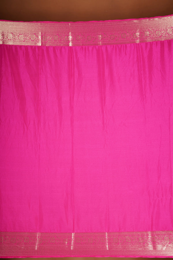 Bright Pink Geogrette Saree- Featuring all over gold floral zari weaving, rich textured patterns, and a broad gold zari border and pallu, giving a luxurious, elegant, and traditional festive look
