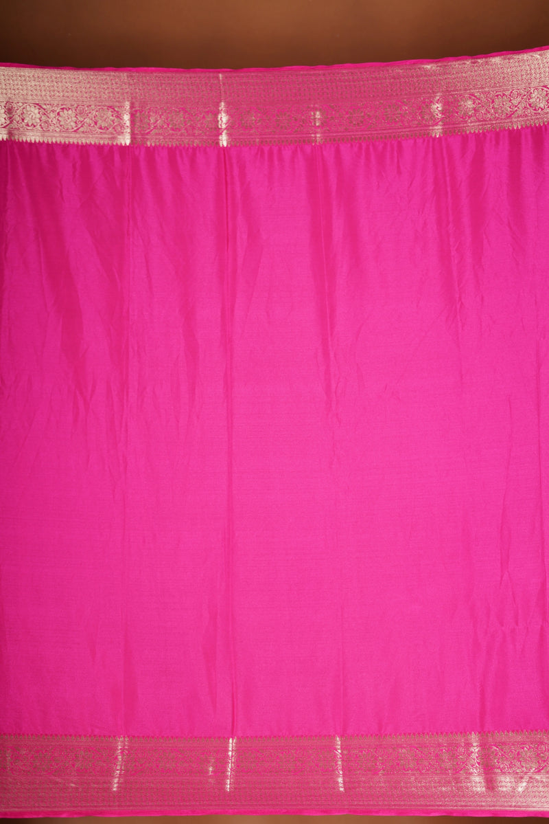Bright Pink Geogrette Saree- Featuring all over gold floral zari weaving, rich textured patterns, and a broad gold zari border and pallu, giving a luxurious, elegant, and traditional festive look