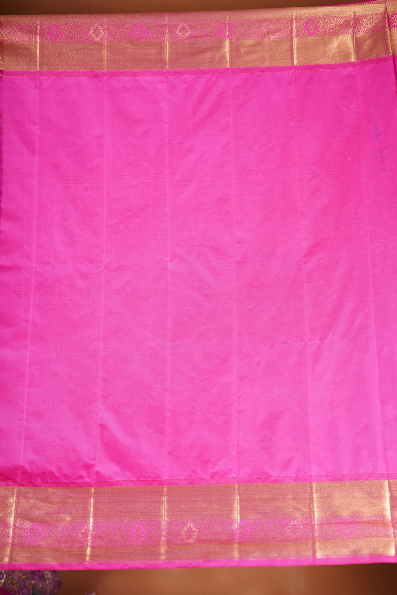 Art Silk Saree - A stunning iridescent grey-silver body accented with a vibrant pink and golden border , self-textured weave with subtle floral&structured golden-pink zari border with traditional panel .
