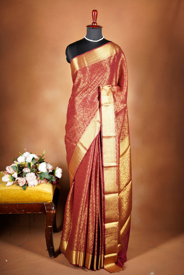 Brick Red Brocade Geogrette Saree- Featuring all over gold floral zari weaving, rich textured patterns, and a broad gold zari border and pallu, giving a luxurious, elegant, and traditional festive look