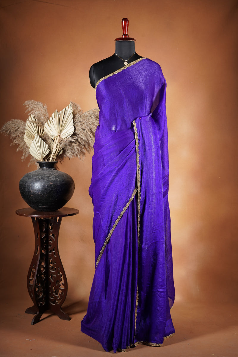 Violet Space Silk Saree – Elegant drape with soft texture and subtle sheen. Enhanced with a refined zari border and attached blouse, this saree blends traditional charm with modern elegance, making it perfect for festive wear and special occasions.