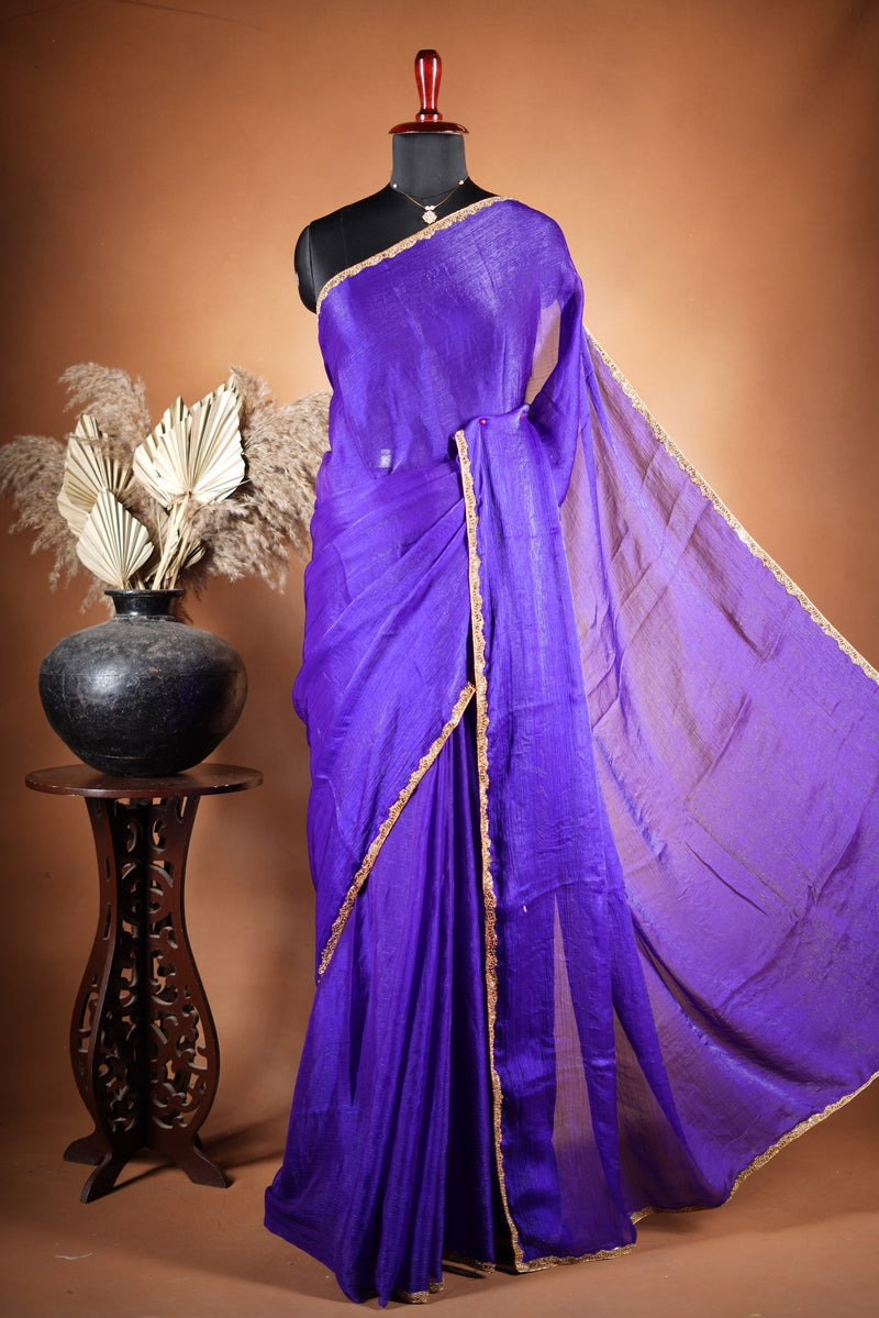 Violet Space Silk Saree – Elegant drape with soft texture and subtle sheen. Enhanced with a refined zari border and attached blouse, this saree blends traditional charm with modern elegance, making it perfect for festive wear and special occasions.