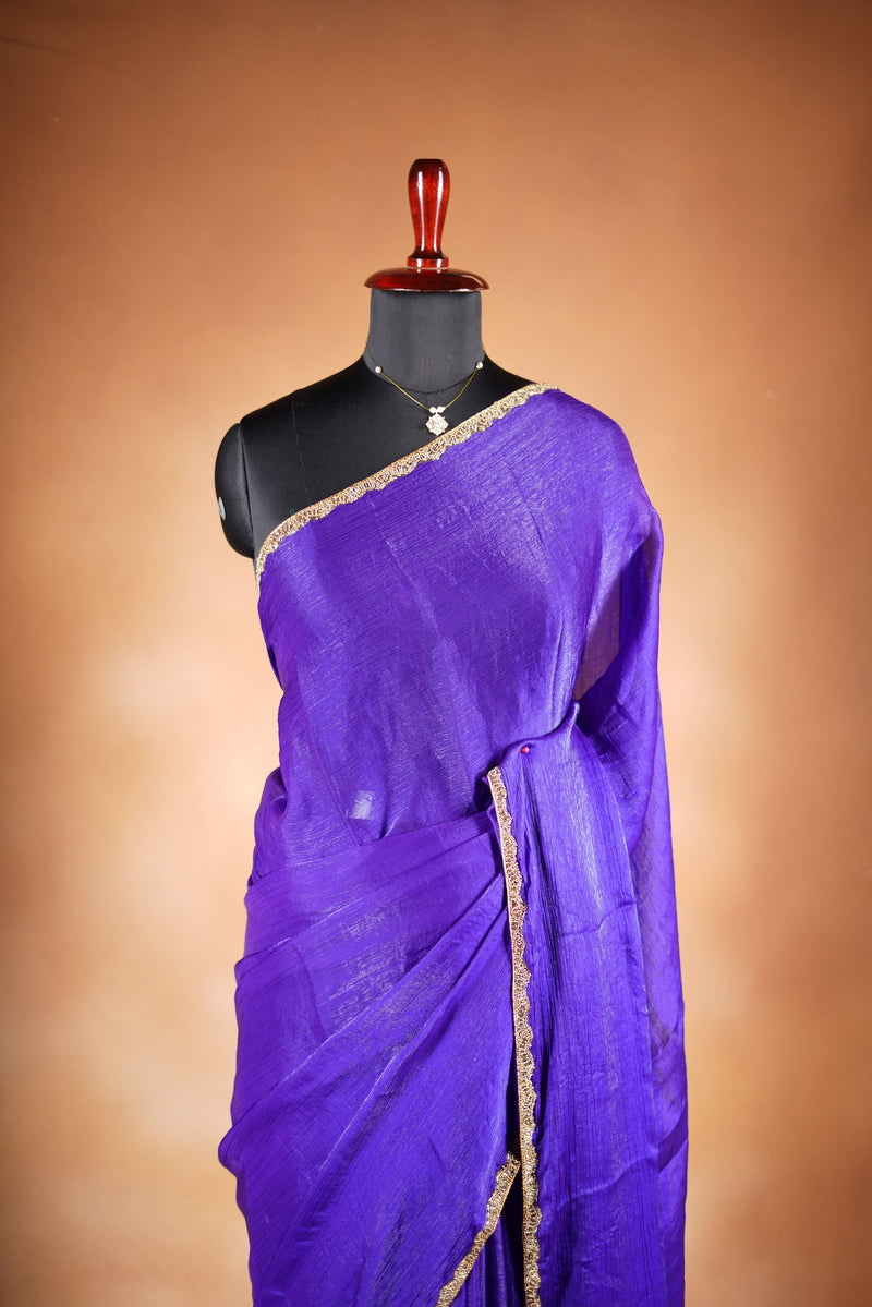 Violet Space Silk Saree – Elegant drape with soft texture and subtle sheen. Enhanced with a refined zari border and attached blouse, this saree blends traditional charm with modern elegance, making it perfect for festive wear and special occasions.