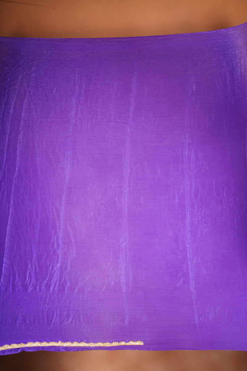 Violet Space Silk Saree – Elegant drape with soft texture and subtle sheen. Enhanced with a refined zari border and attached blouse, this saree blends traditional charm with modern elegance, making it perfect for festive wear and special occasions.