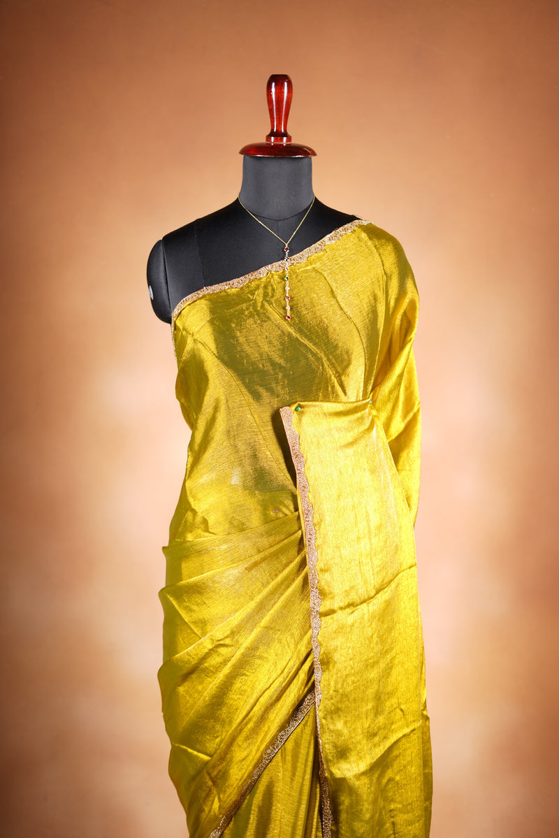 Metallic Gold Space Silk Saree – Brighten your collection with this golden yellow saree, featuring a smooth texture and elegant shine. With a subtle zari border and solid blouse, this lightweight drape blends modern style and traditional grace.
