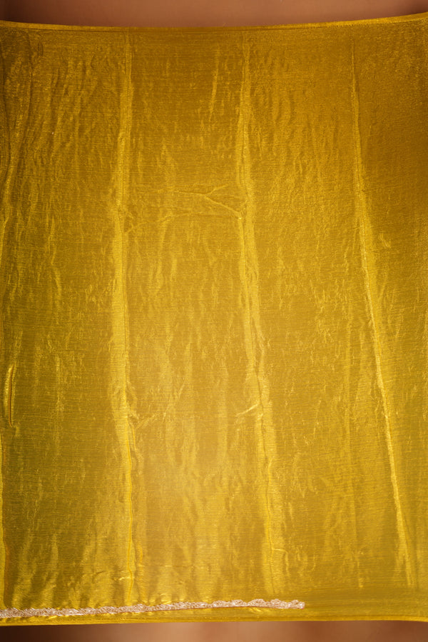 Metallic Gold Space Silk Saree – Brighten your collection with this golden yellow saree, featuring a smooth texture and elegant shine. With a subtle zari border and solid blouse, this lightweight drape blends modern style and traditional grace.
