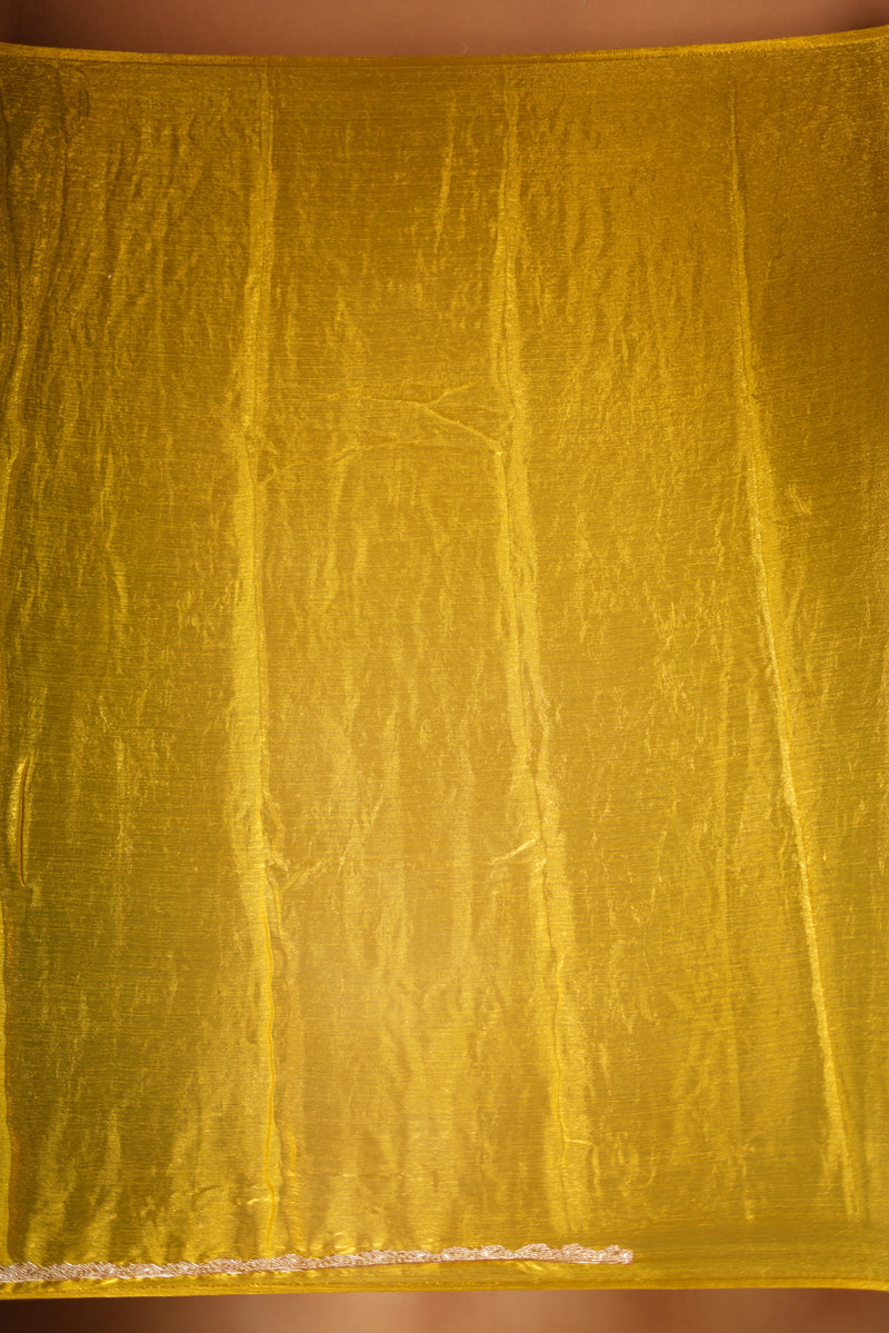 Metallic Gold Space Silk Saree – Brighten your collection with this golden yellow saree, featuring a smooth texture and elegant shine. With a subtle zari border and solid blouse, this lightweight drape blends modern style and traditional grace.
