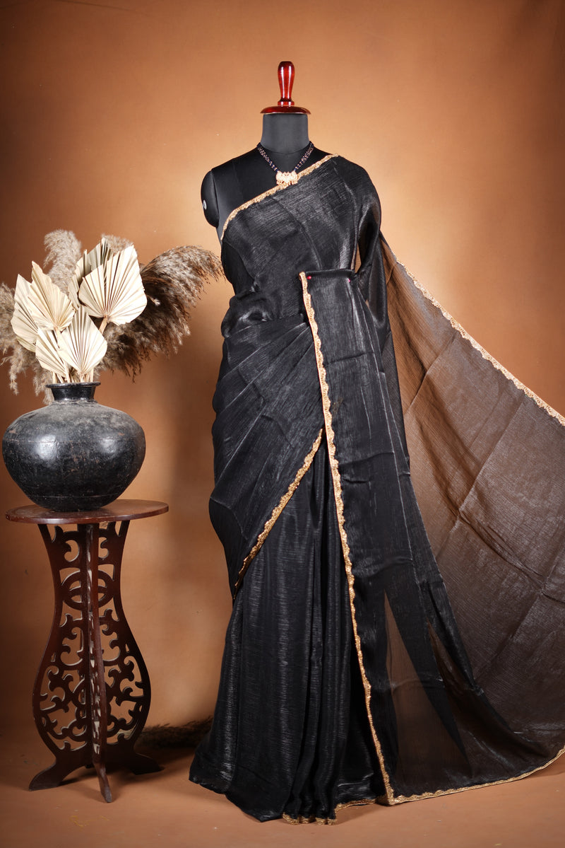 Classic Black Space Silk Saree Elevate your style with this classic black space silk saree, featuring a smooth texture and elegant sheen. Finished with a refined zari border, this lightweight saree blends modern sophistication with traditional charm
