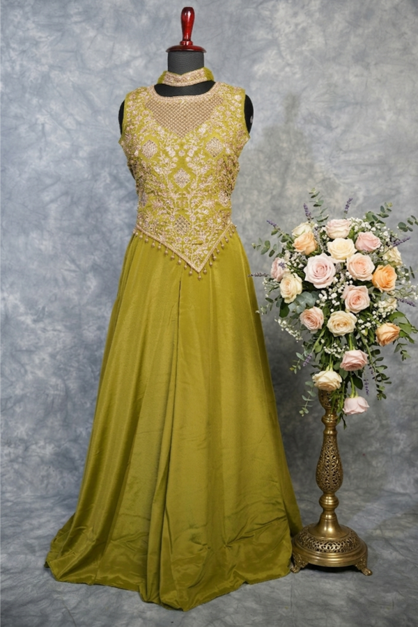 Olive Royale Embroidered Anarkali  – A rich olive Anarkali featuring intricate embroidery that enhances its regal appeal. Designed for elegance, the flowing silhouette and matching choker create a graceful.