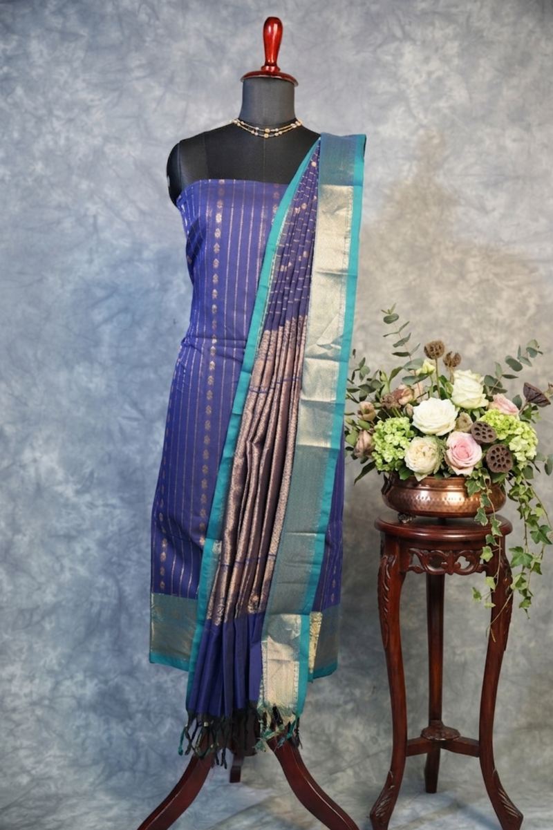 Blue saree with a floral arrangement on a gray background