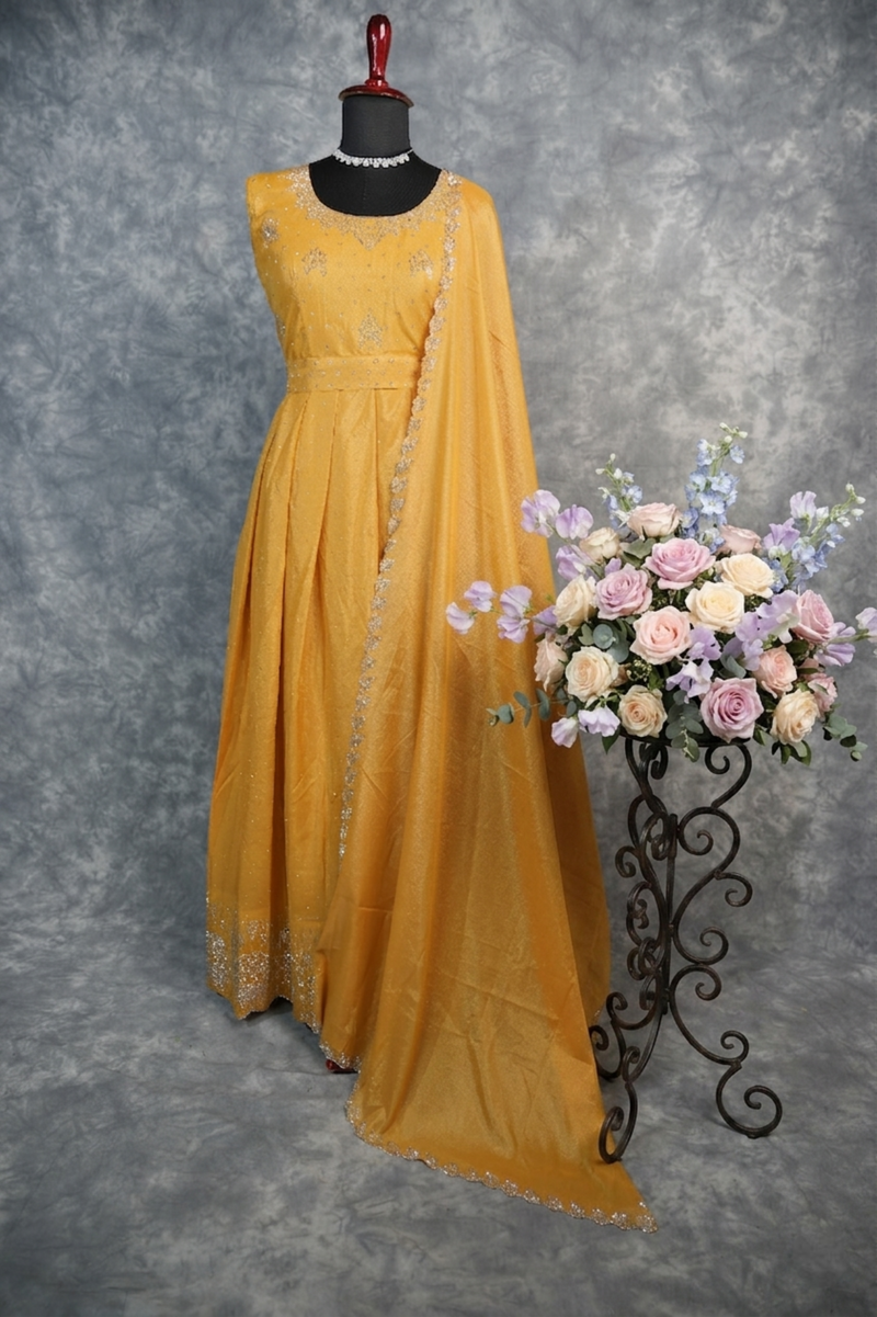 Yellow Chiffon Stone Chudi Maxi Set - A radiant yellow chiffon maxi set adorned with delicate stone detailing that adds a subtle sparkle. Designed with a graceful flow and lightweight comfort, it offers an elegant.